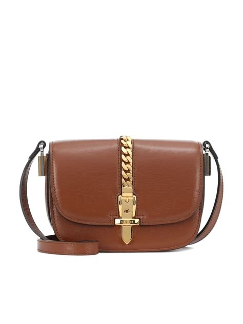 Sylvie 1969 small shoulder bag in brown leather .